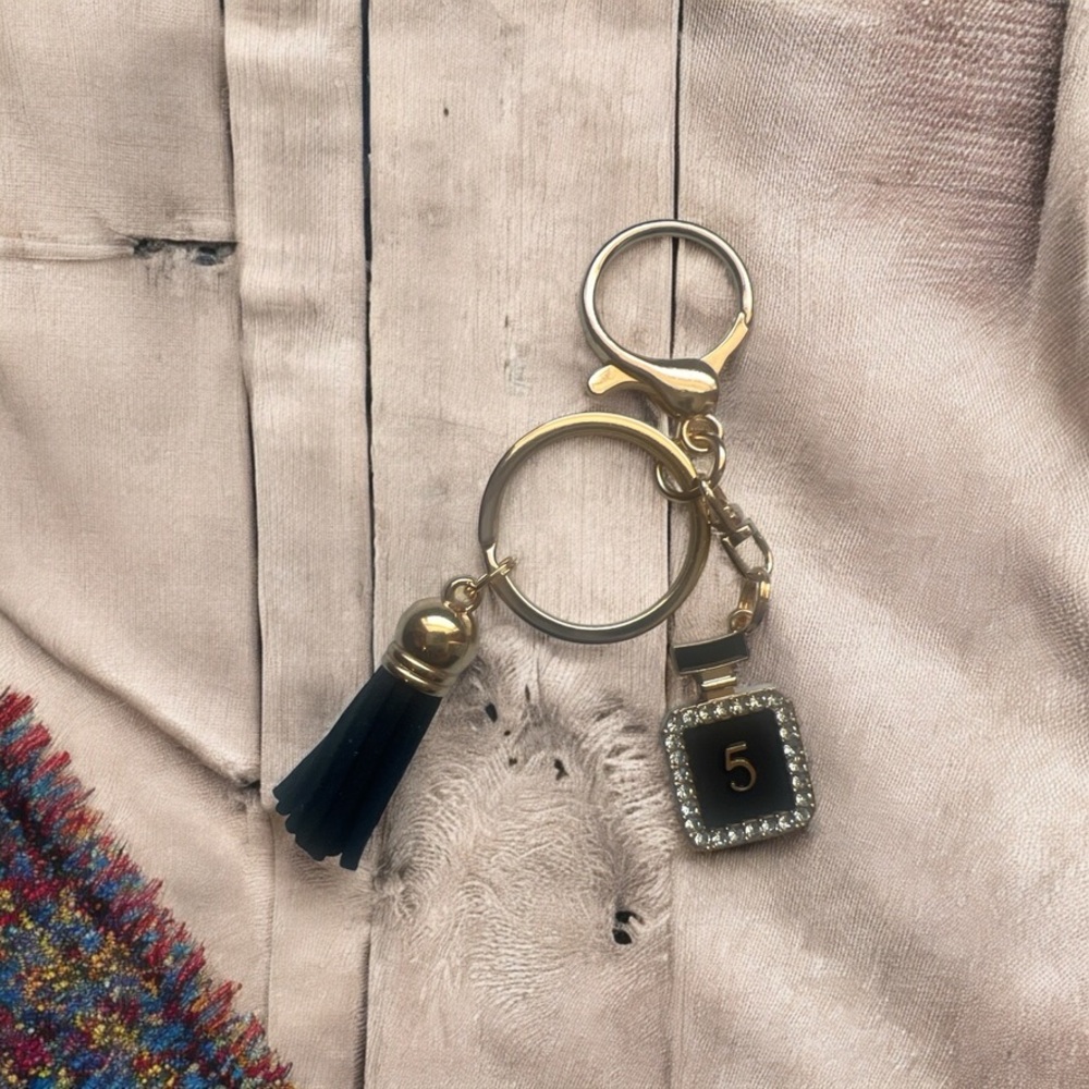 Elegant Black and Gold Keychain with Tassel